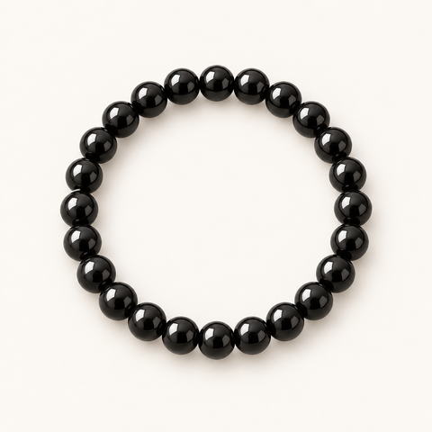 Java Black Obsidian Armband mit tiefschwarzen Natursteinperlen auf hellem Hintergrund.
